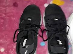 cumshot lands right on the tennis shoes in fetish play.