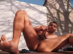 suave outdoor masturbation view of muscled guy's hard cock satisfaction