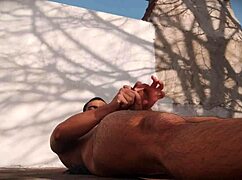 suave outdoor masturbation view of muscled guy's hard cock satisfaction