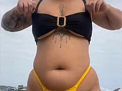 yellow bikini splits swollen pussy for beach stares
