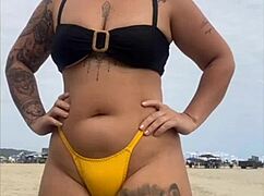yellow bikini splits swollen pussy for beach stares