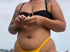 yellow bikini splits swollen pussy for beach stares
