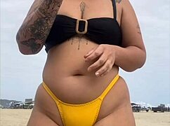 yellow bikini splits swollen pussy for beach stares