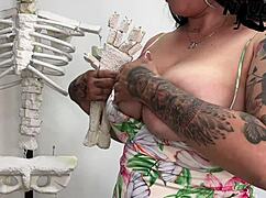 Hot damn, horny milf fingers pussy wildly in doctor's office!