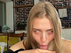 Cutie slurps cock then slides on condom