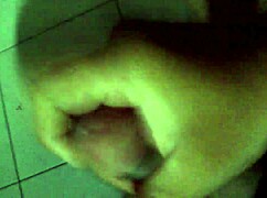 A man masturbates rapidly with intense focus.