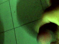 A man masturbates rapidly with intense focus.