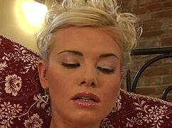 Blonde milf Caylian Curtis masturbates shaved pussy in heels and lingerie solo