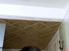 elegant tall brunette steps into the shower letting water cascade over her classy petite frame