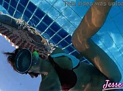 Petite Asian swims outdoors with buttplug gaping ass to mouth