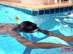 Petite Asian swims outdoors with buttplug gaping ass to mouth