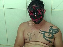 masked tattooed muscular man showers solo playing with toy till cum