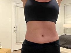 this muscular milf housewife flexes big tits for fitness fans