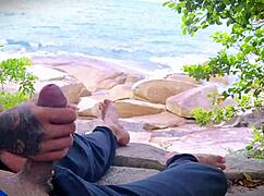 guy masturbates with handjob surprise cumshot on crowded beach