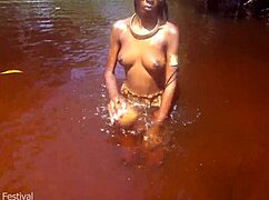 skinny tribe slut shows off her tits at the beach