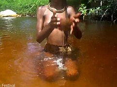 skinny tribe slut shows off her tits at the beach