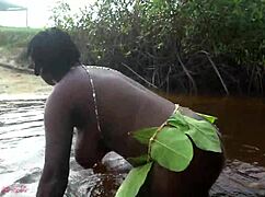 busty african ebony grinds huge ass and big tits in outdoor ritual dance