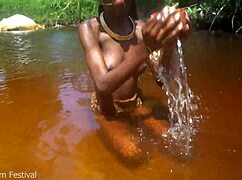 skinny tribe slut shows off her tits at the beach