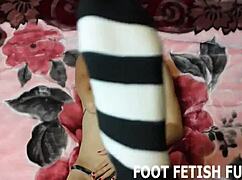 She commands you to kneel and worship her perfect feet in this intense femdom POV session with fetish tease