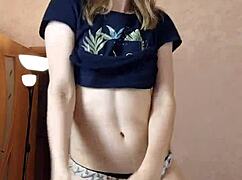 A beautiful woman dances seductively and plays intimately for webcam viewers