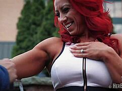 tia marie flexes her muscular biceps and sexy redhead boobs – measure up?