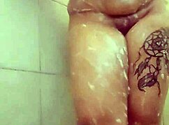 Curvy BBW babe soaps up big tits and ass in steamy shower tease