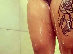 Curvy BBW babe soaps up big tits and ass in steamy shower tease