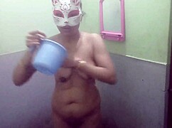 Indian girl showers in winter for live audience