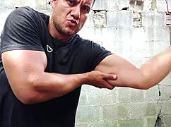 Yuri gaúcho flexes muscles, strokes huge cock, and unloads cum outdoors