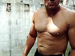 Yuri gaúcho flexes muscles, strokes huge cock, and unloads cum outdoors