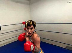 Watch out! Pro fighter smothers you topless in fierce tit attack!