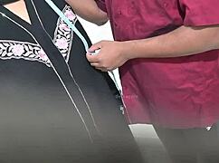 Doctor carefully examines hijab lady patient in hospital setting