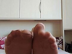 carmen's sexy nylon pantyhose feet tease from bed in happy nylonjunge play