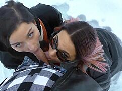 two girls take turns warming up a cock outdoors in the snow