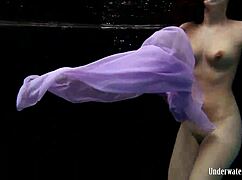 Blackhaired Aneta Swims Nude Underwater in Pool