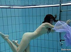 Blackhaired Aneta Swims Nude Underwater in Pool