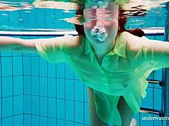 Shy Russian blonde Nina Mohnatka swims with her perky small tits out