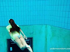 Shy Russian blonde Nina Mohnatka swims with her perky small tits out