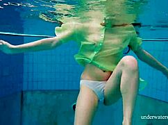 Shy Russian blonde Nina Mohnatka swims with her perky small tits out