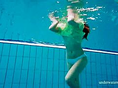 Shy Russian blonde Nina Mohnatka swims with her perky small tits out