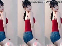 cute chinese girl bounces up and down dancing sexy