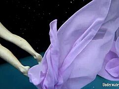 Aneta squeezes big tits in purple dress underwater pool tease