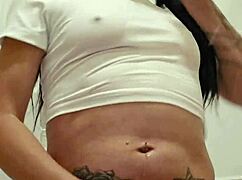 Emy Angel's wet t-shirt gets soaked!