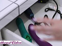 Shaved brunette moans rubbing pussy while blonde girlfriend dildo fucks her tight ass.