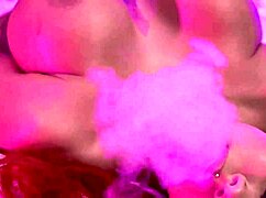 Busty curvy redhead smokes during pierced nipple tease