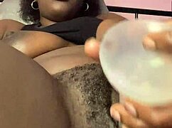 Ebony babe spreads creamy pretty pussy solo