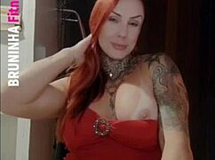 damn that sexy tattooed redhead in a dress no panties looks horny