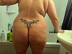 Hidden cam catches candid bbw milf soaking wet shower.