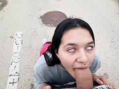 Brunette's lips wrapped tight around monster street cock