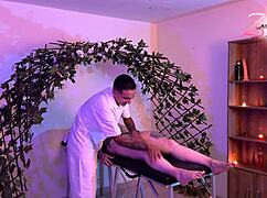 The masseuse leaves her burning with need. She masturbates furiously before his return.